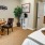 a living room with a bed and a table
