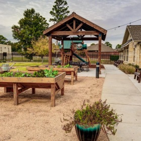 A beautiful community is waiting for you a picnic table and chairs outside