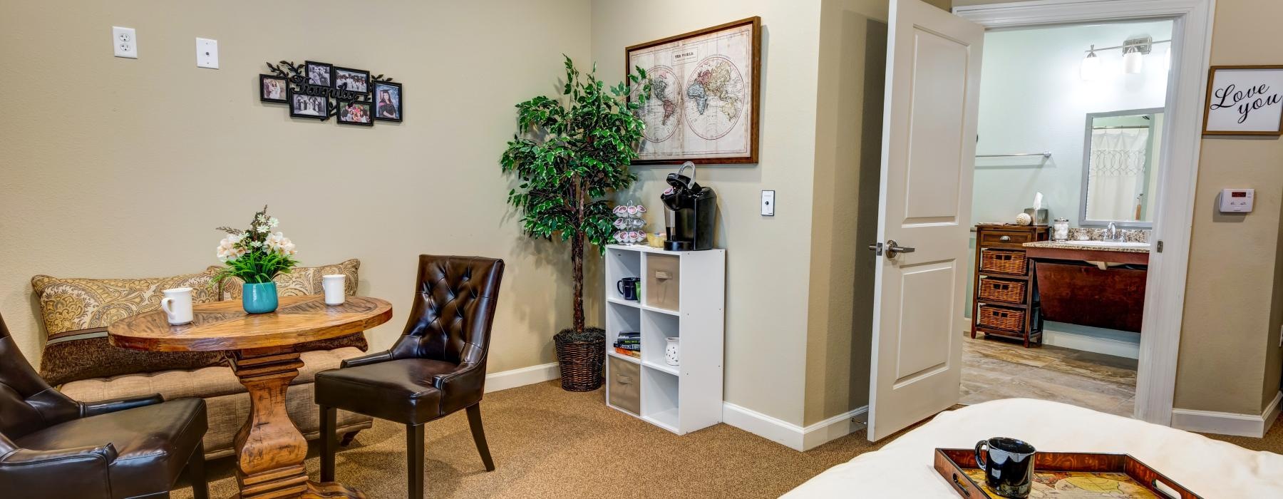 a living room with a bed and a table